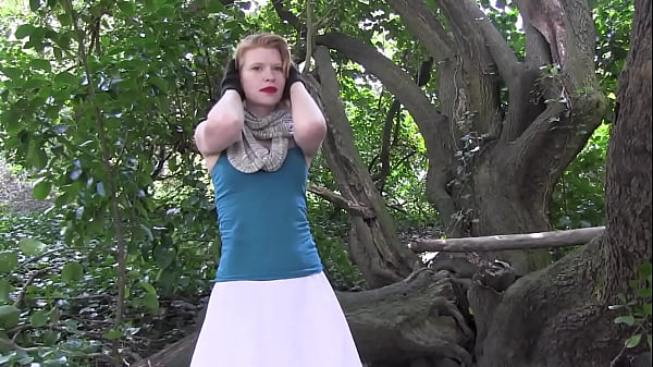Wild Hairy Bush Action: Red-Haired Natural Beauty in Tree